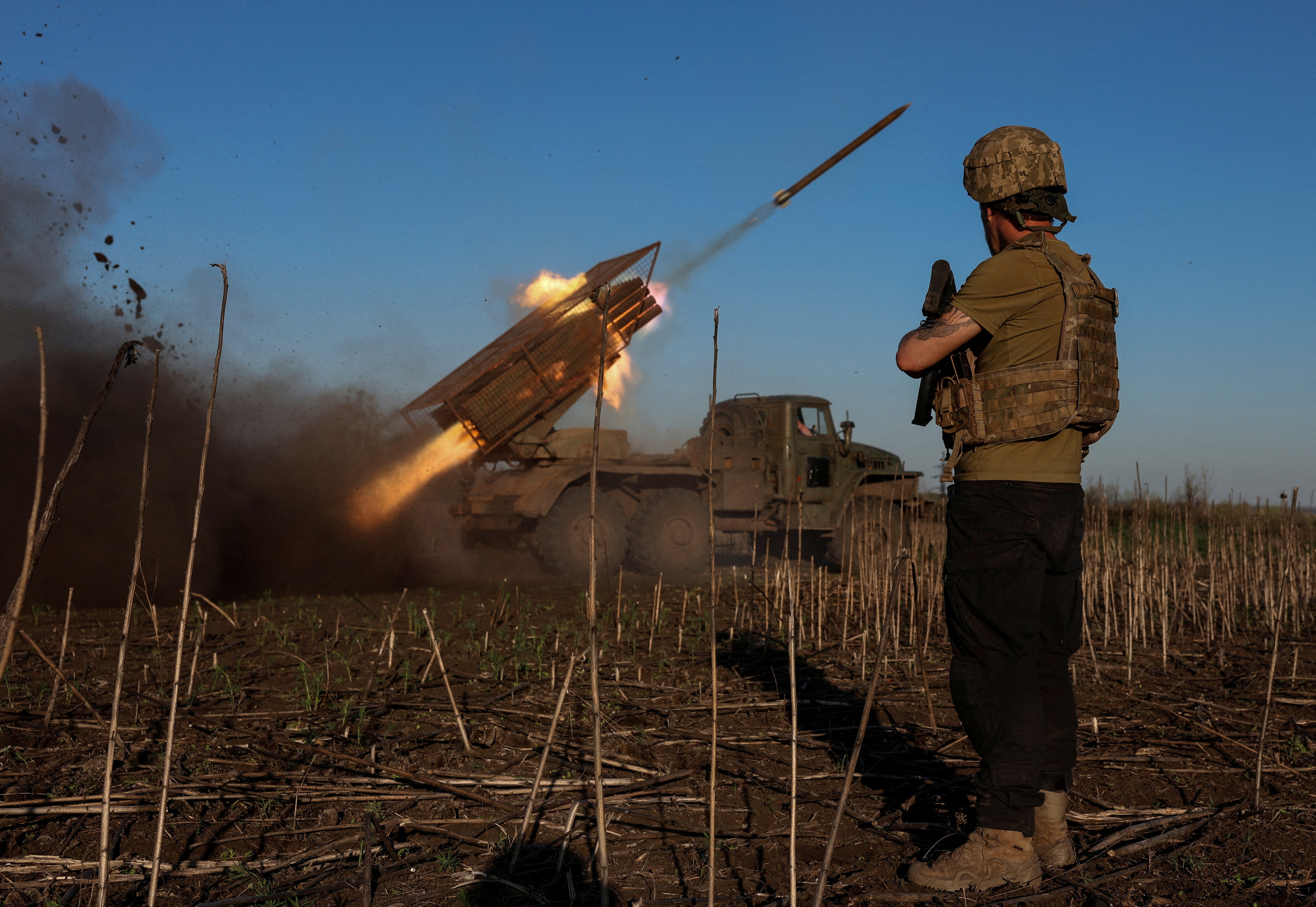 Ukrainian servicemen fire a Grad MLRS towards Russian troops near the frontline town of Pokrovsk