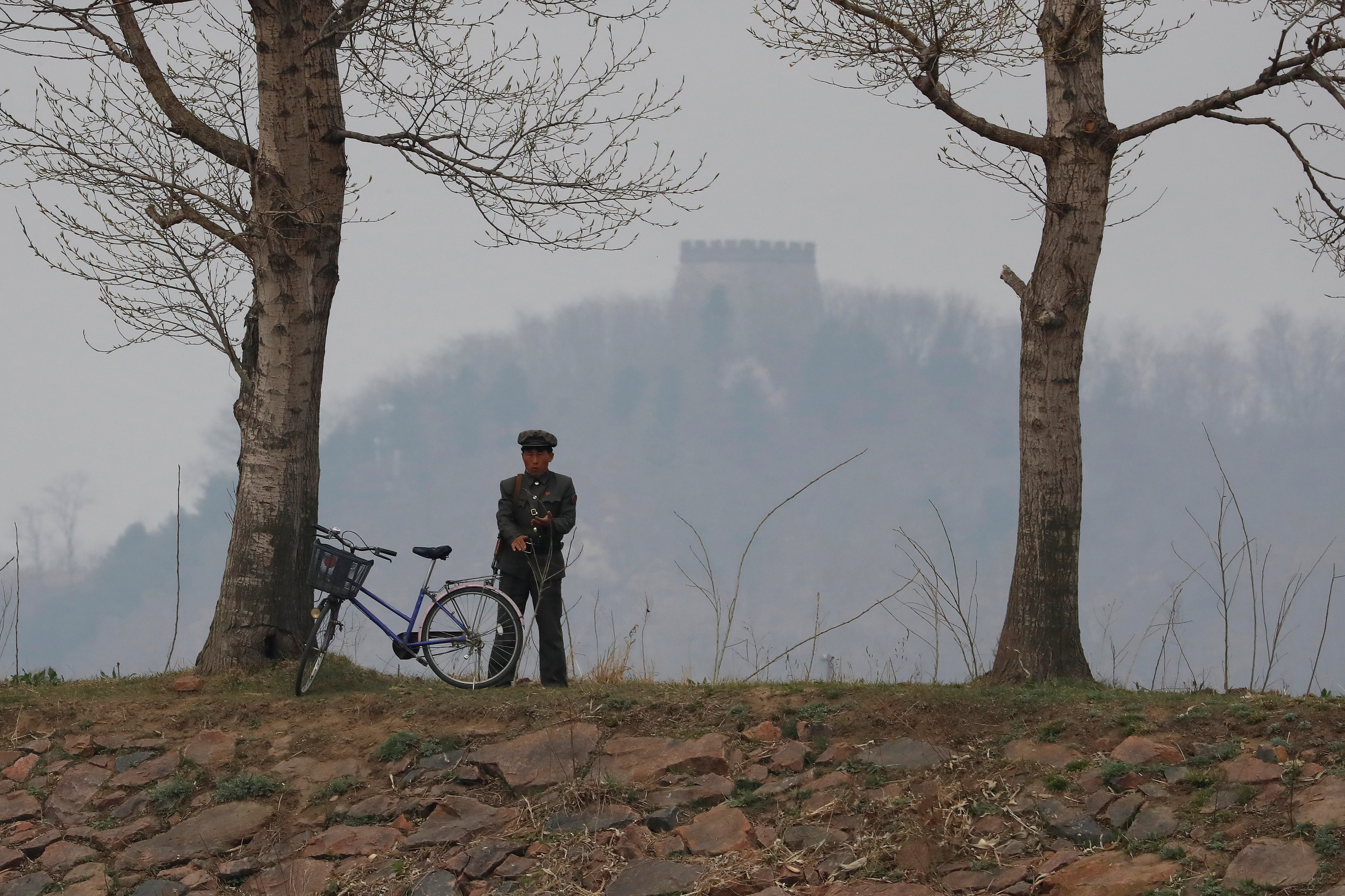 A North Korean soldier keeps watch at the Yalu River in Sinuiju, North Korea, which borders Dandong