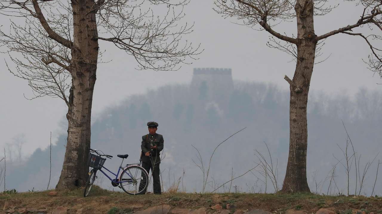 A North Korean soldier keeps watch at the Yalu River in Sinuiju, North Korea, which borders Dandong