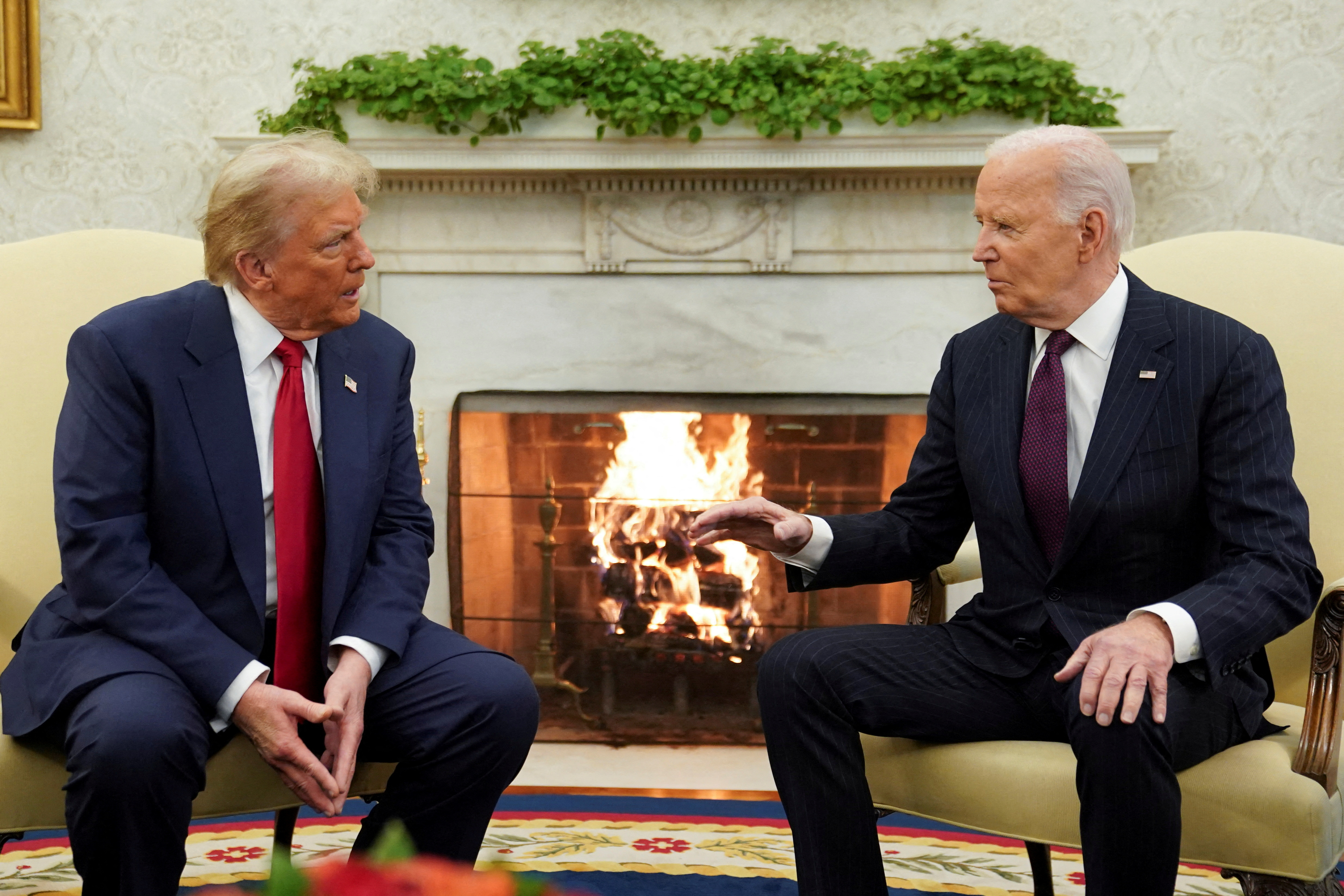 FILE PHOTO: U.S. President Joe Biden meets with President-elect Donald Trump in the Oval Office at the White House in Washington