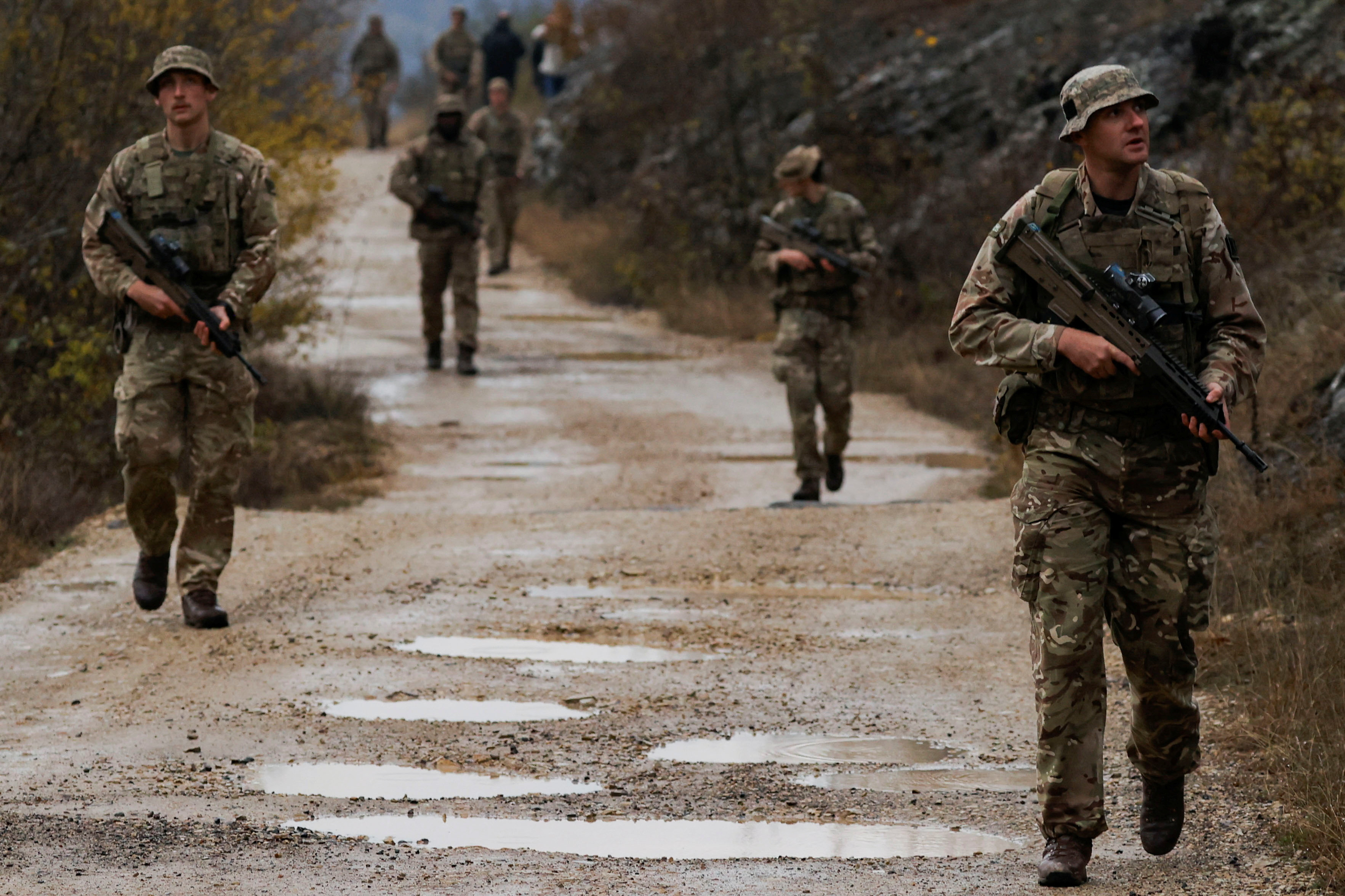 British troops part of the NATO reinforcements patrol at the Kosovo-Serbia border, in Jarinje