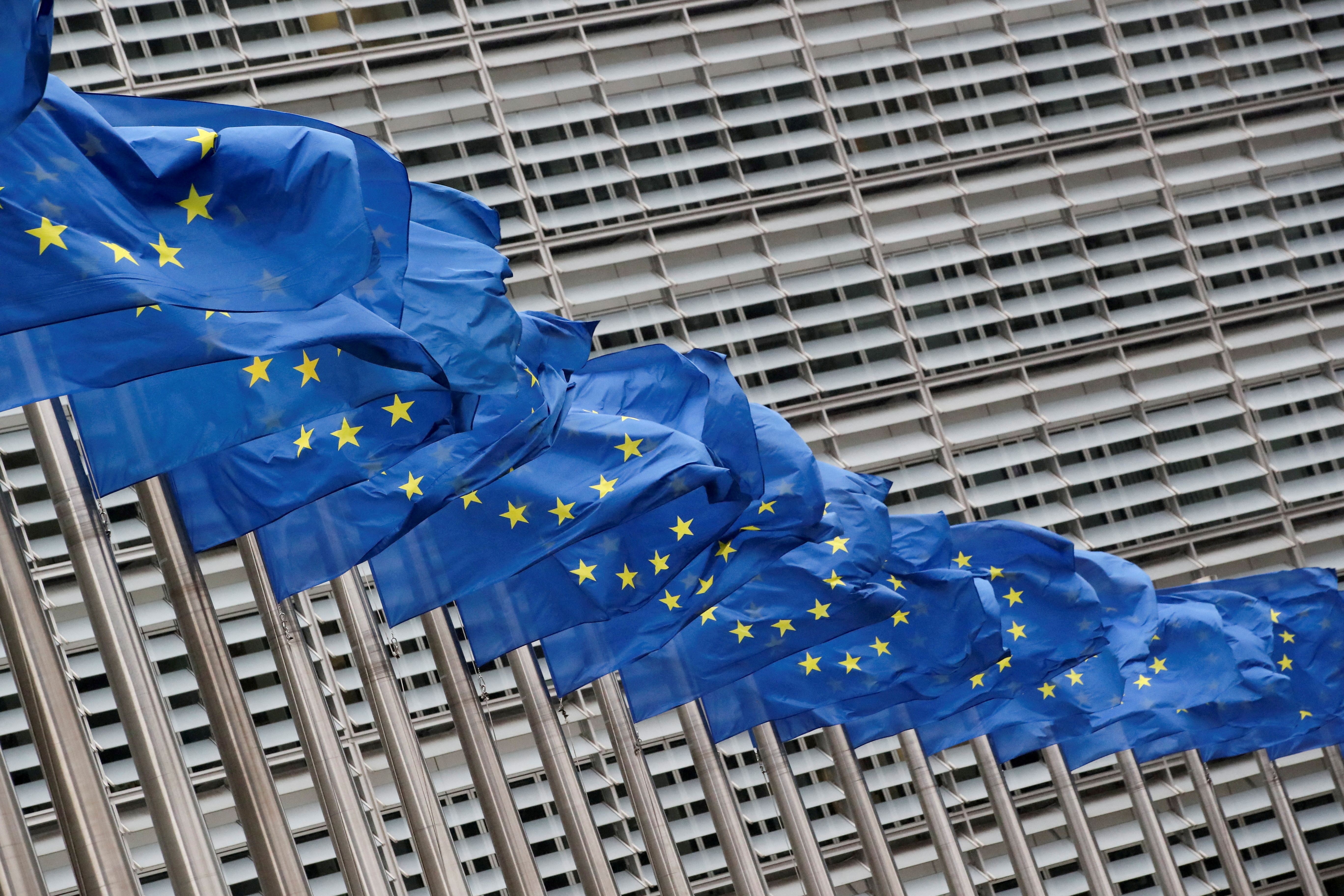 FILE PHOTO: Flags flutter outside EU Commission in Brussels