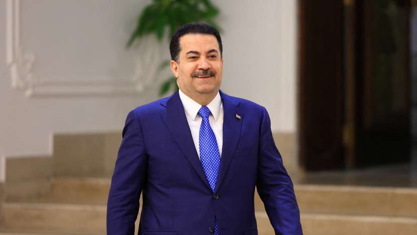 Iraqi Prime Minister Mohammed Shia al-Sudani walks before an interview with Reuters in Baghdad