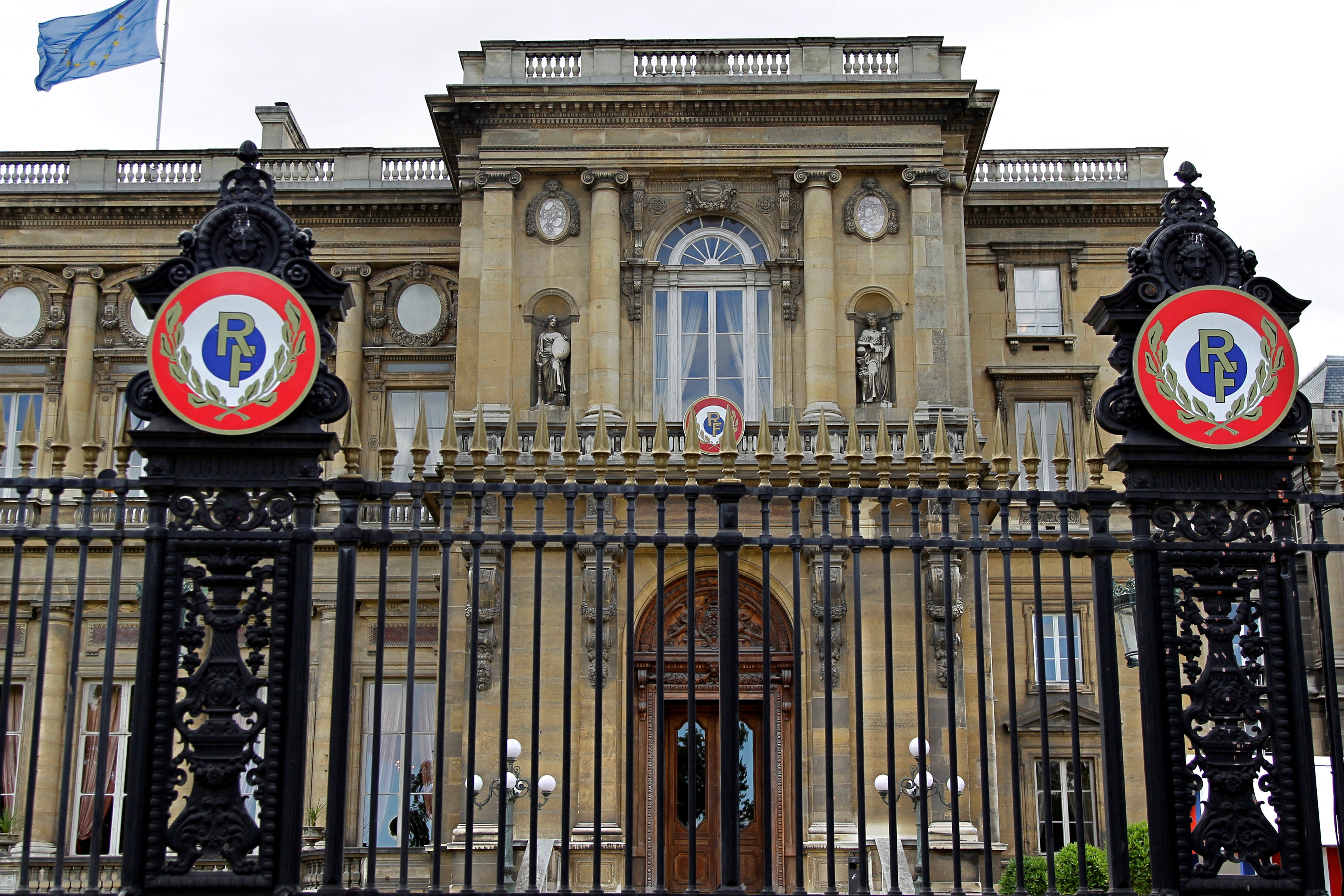 FILE PHOTO: Flags fly from the roof of France's Foreign and European Affairs Ministry in Paris