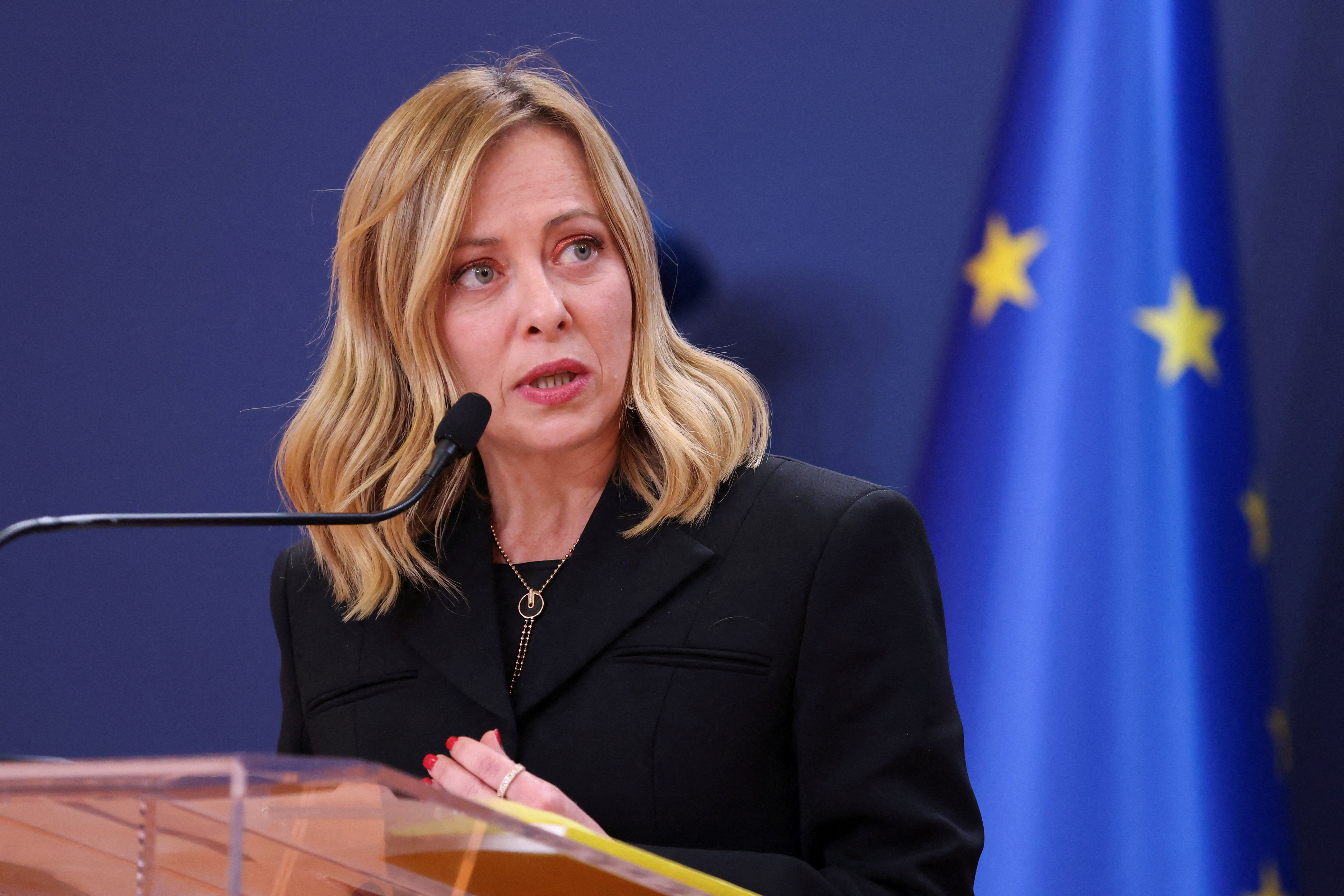FILE PHOTO: Italian Prime Minister Giorgia Meloni speaks during a press conference in Belgrade