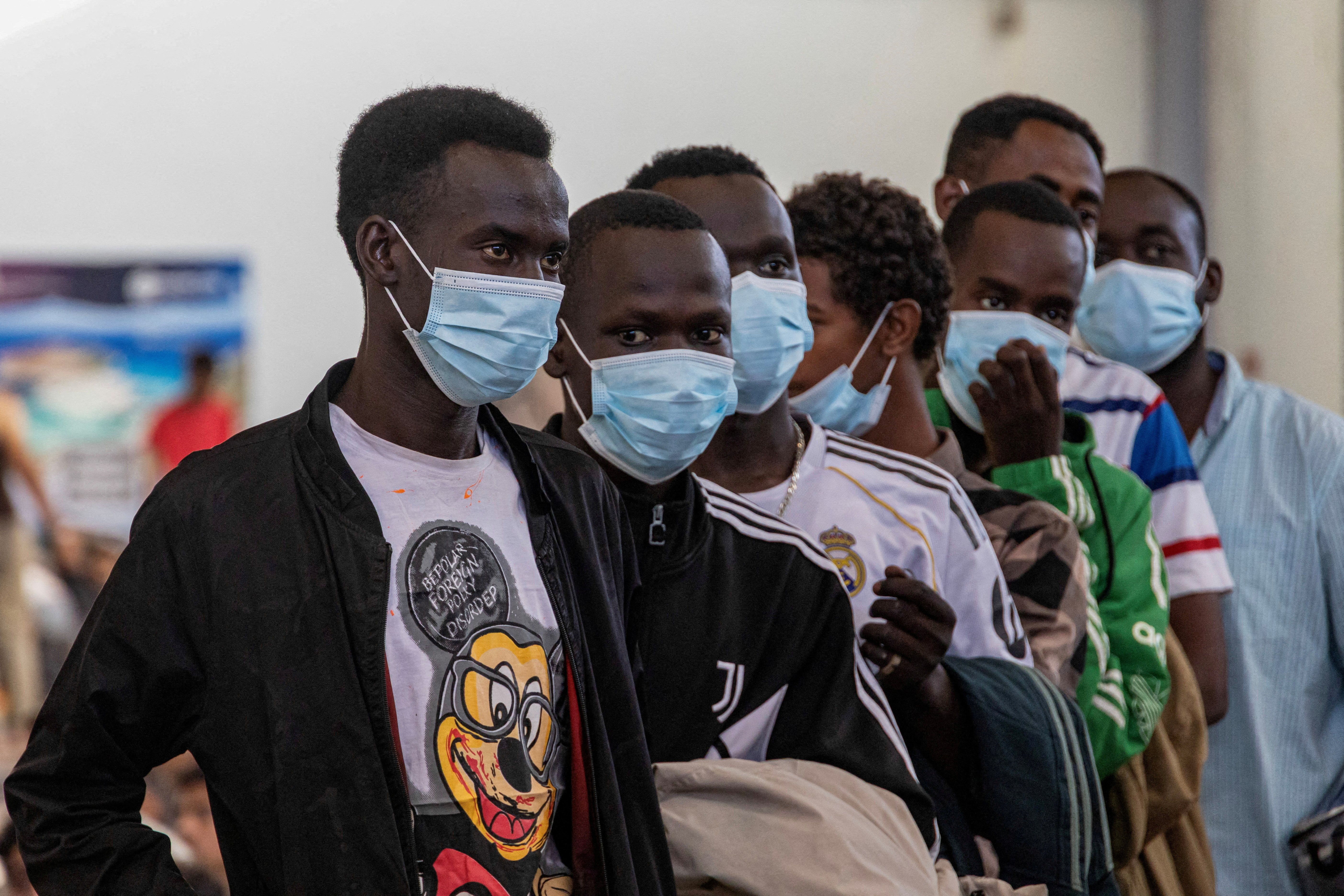 FILE PHOTO: Newly-arrived migrants on the island of Crete