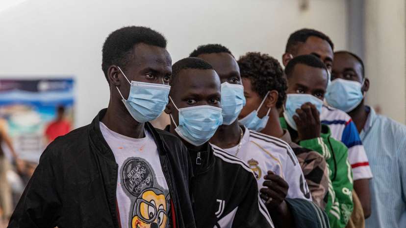 FILE PHOTO: Newly-arrived migrants on the island of Crete