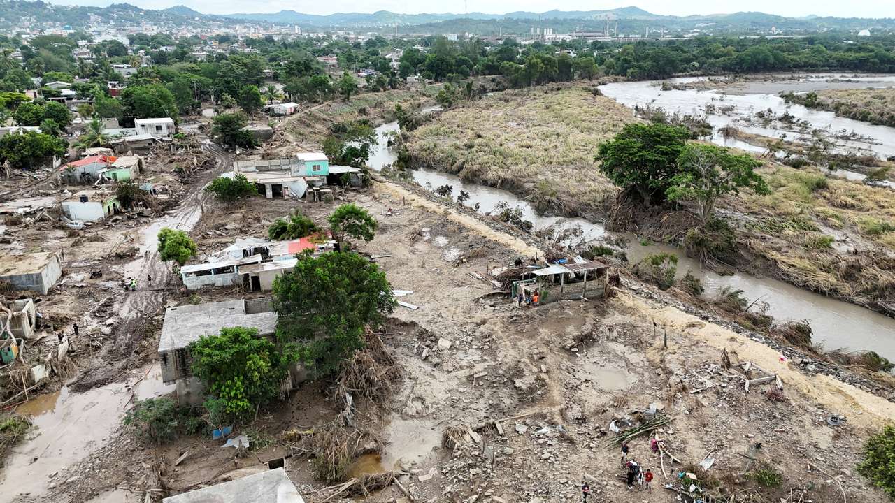 FILE PHOTO: Drone view shows fallen trees, debris and damaged houses amid muddy floodwater after a river overflowed following torrential rains, in Mexico