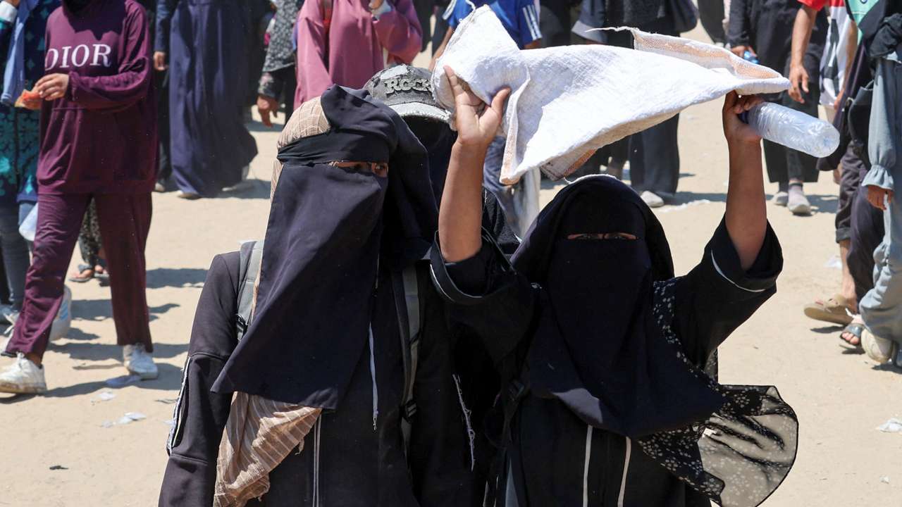 Palestinians seek aid from the U.S.-backed Gaza Humanitarian Foundation, near Rafah