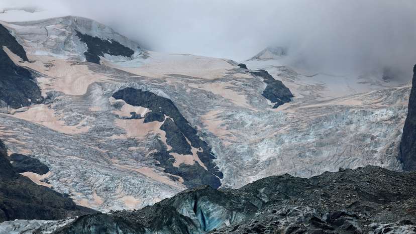 FILE PHOTO: Crevasses and Sahara dust are seen on the Morteratsch Glacier, in Pontresina