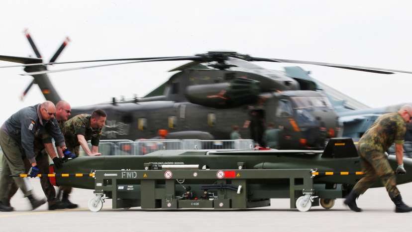 FILE PHOTO: German soldiers move a dummy Taurus bomb during preparations for the upcoming ILA Berlin Air Show in Schoenefeld