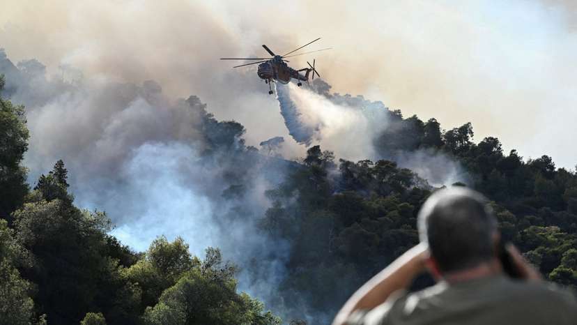 FILE PHOTO: Wildfire burns near the village of Helidori, near Corinth