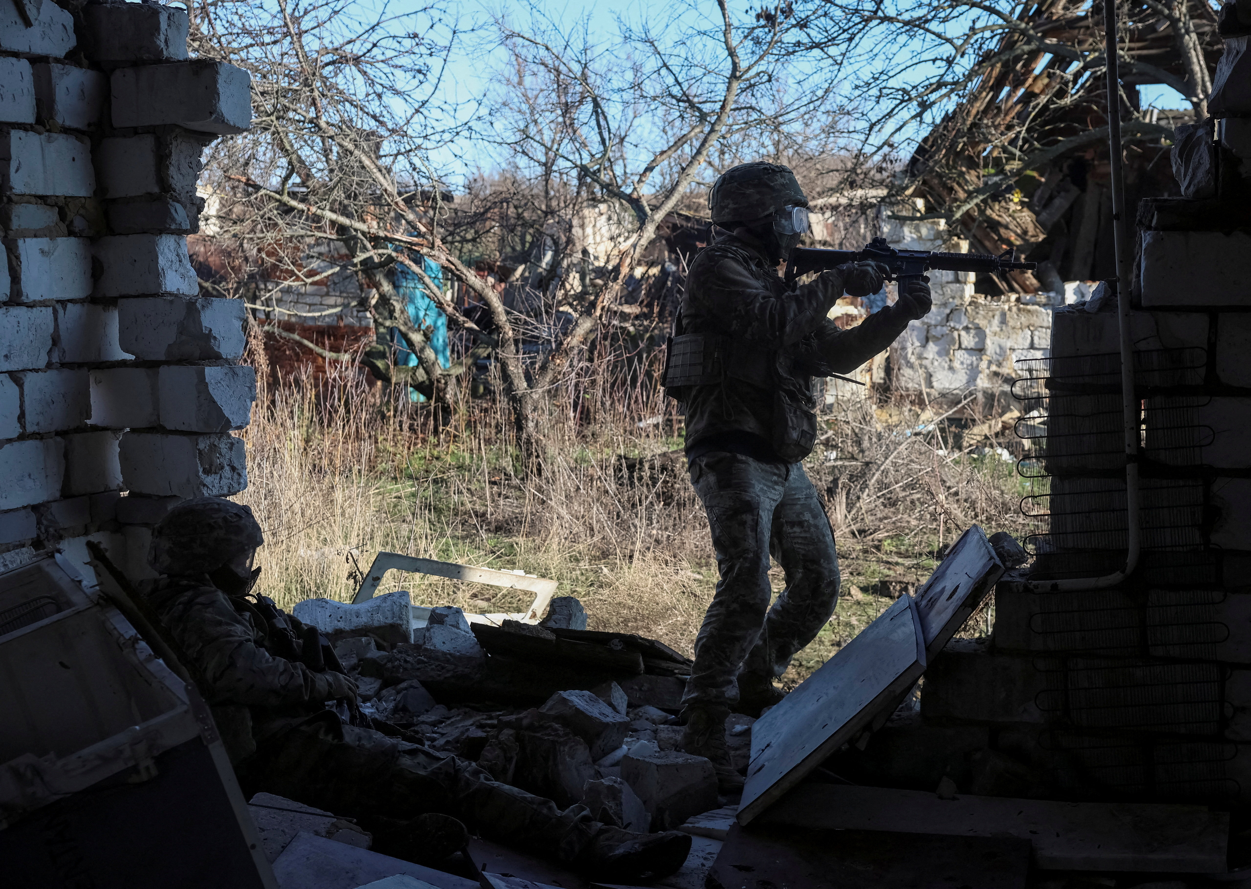 Ukrainian servicemen attend a basic military exercise in Kharkiv region