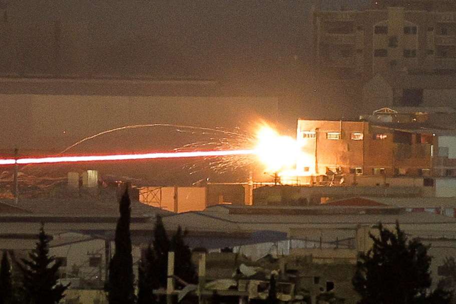 A missile hits a house in northern Gaza, amid the ongoing conflict between Israel and the Palestinian Islamist group Hamas, as seen from Israel, May 11, 2024. REUTERS/Amir Cohen