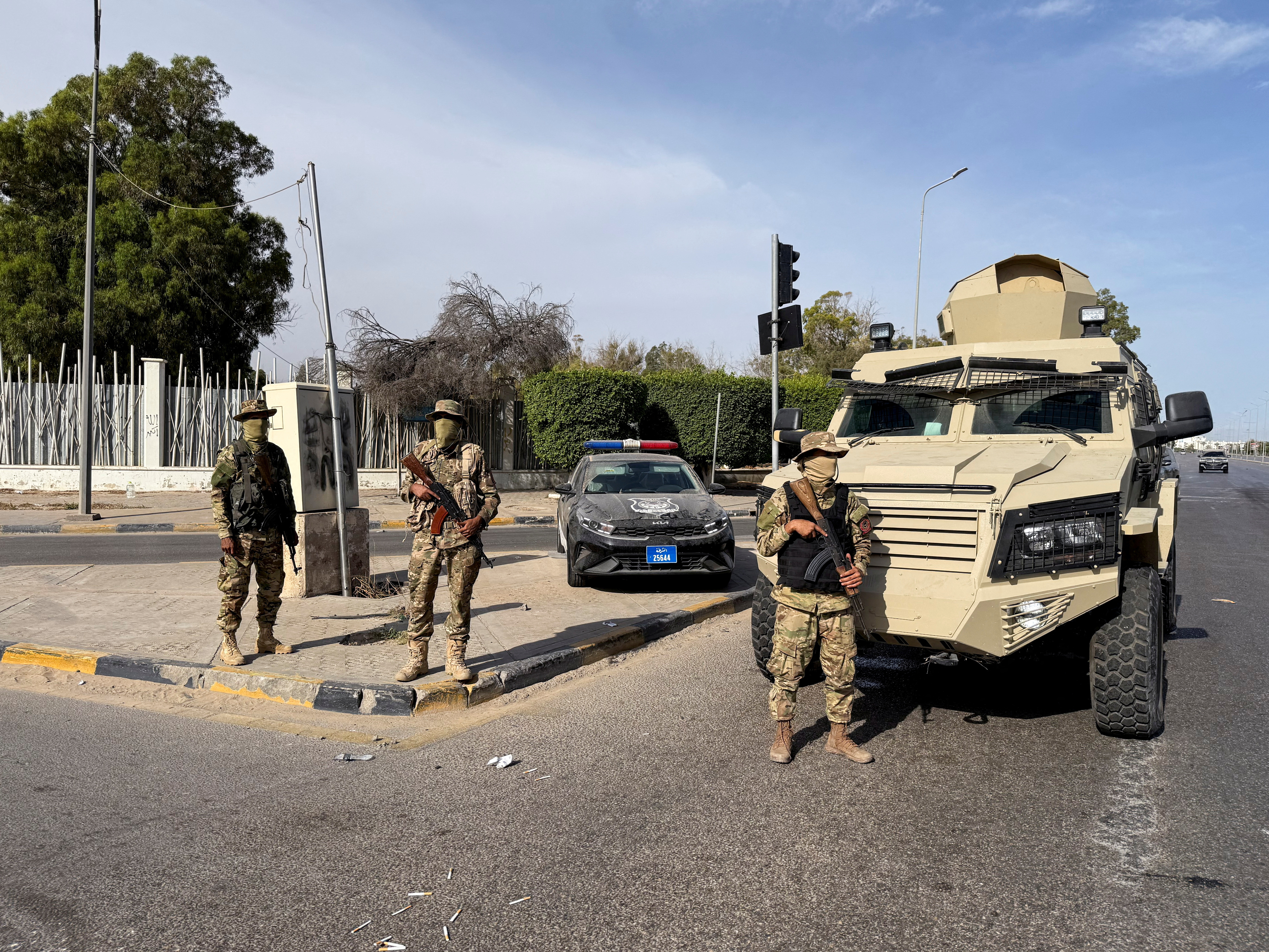 FILE PHOTO: Members of the 444 Brigade of the Libyan Army stand guard at Abu Salim area in Tripoli