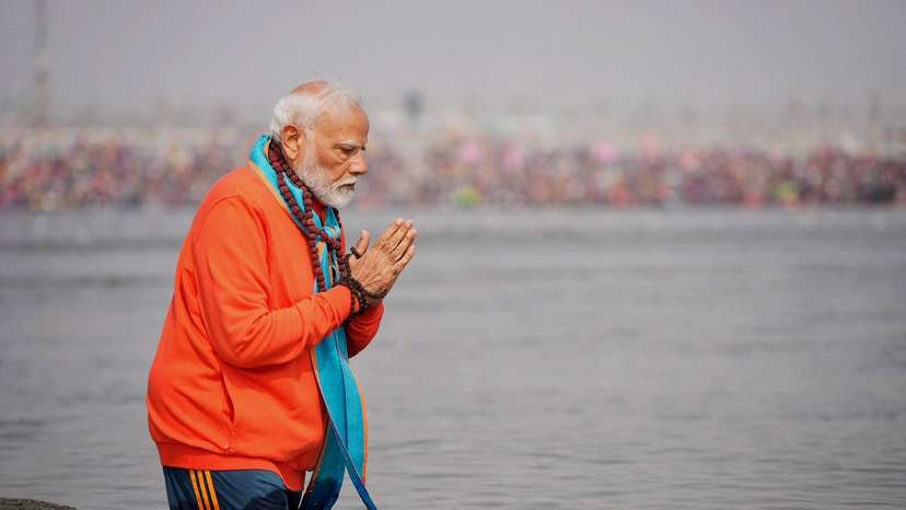 India's Prime Minister Narendra Modi prays as he takes a holy dip during the ongoing "Maha Kumbh Mela", or the Great Pitcher Festival, in Prayagraj