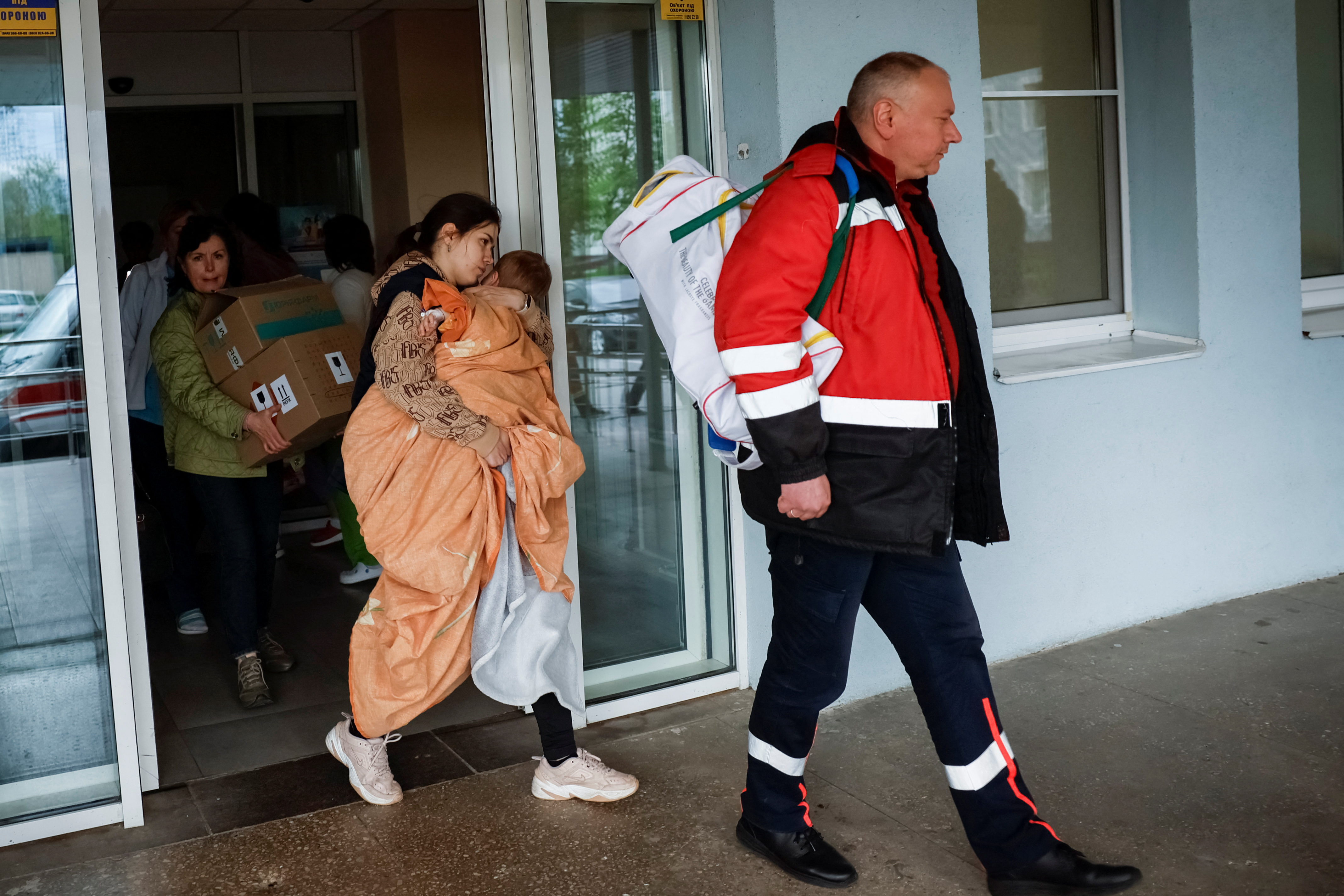 People evacuate hospital after authorities declare possible danger of Russian strike, in Kyiv
