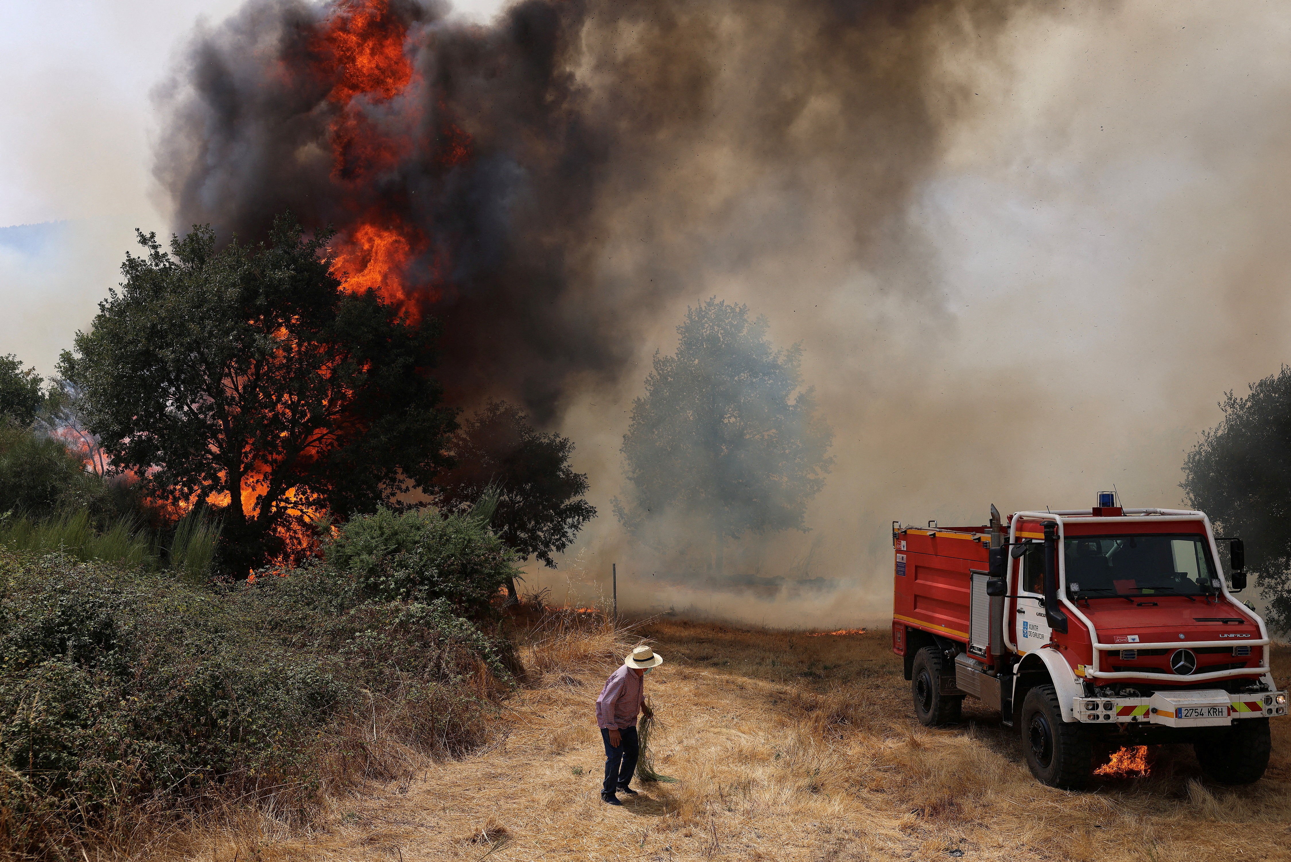 FILE PHOTO: Wildfire rages in Galicia