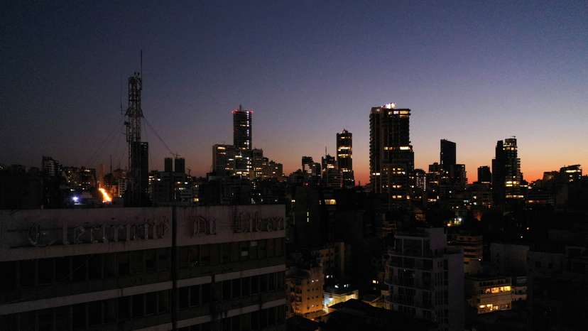 A view shows the exterior of Lebanon's Electricity Company and residential buildings during sunset, in Beirut