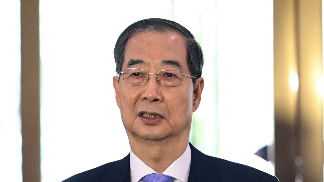 FILE PHOTO: South Korean Prime Minister Han Duck-soo speaks to the media as he arrives at the Government Complex in Seoul