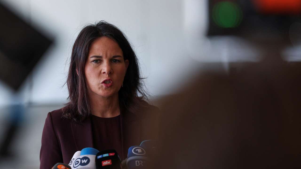 German Foreign Minister Annalena Baerbock delivers a statement at Ben Gurion International Airport in Lod