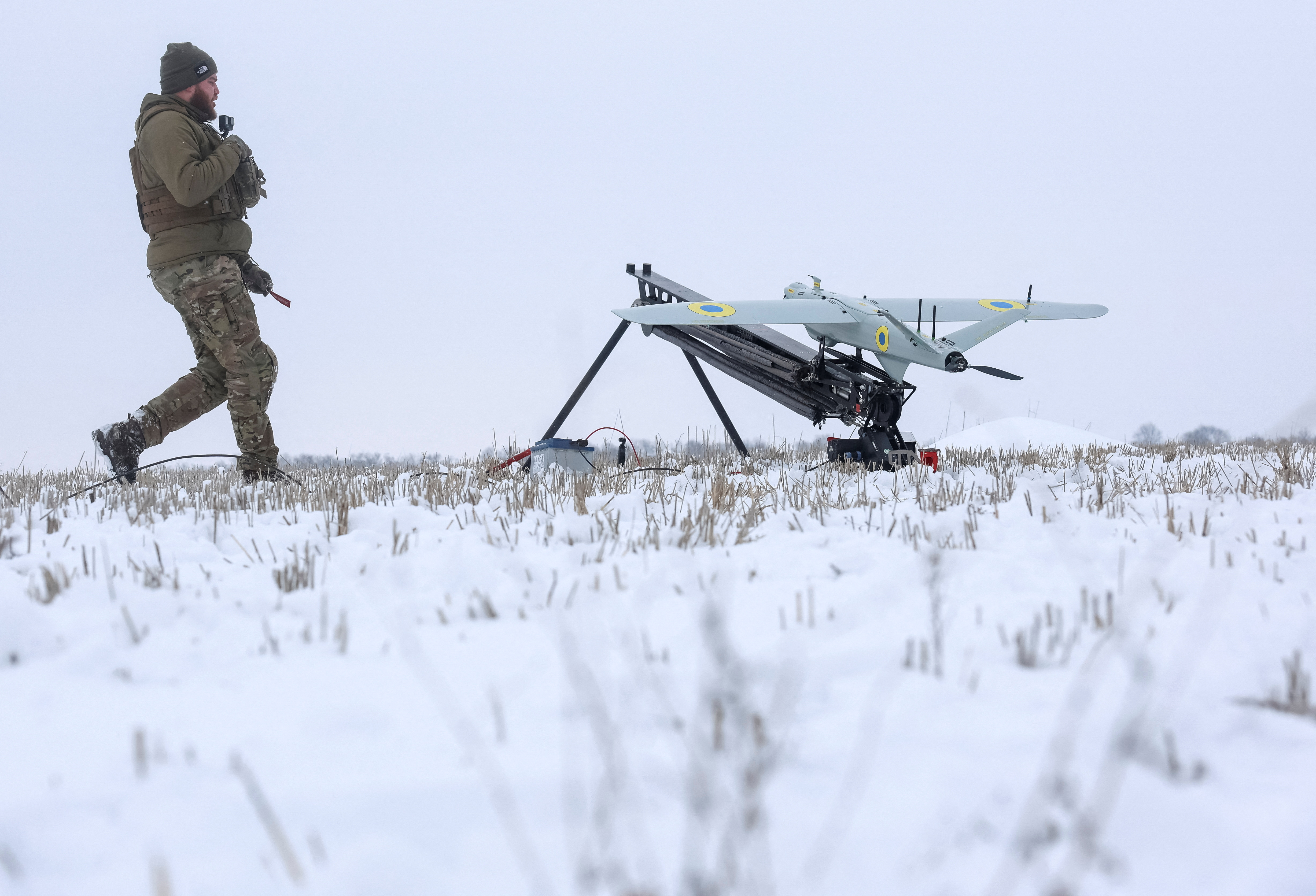 A Ukrainian serviceman prepares to launch precision-guided loitering munition in Kharkiv region
