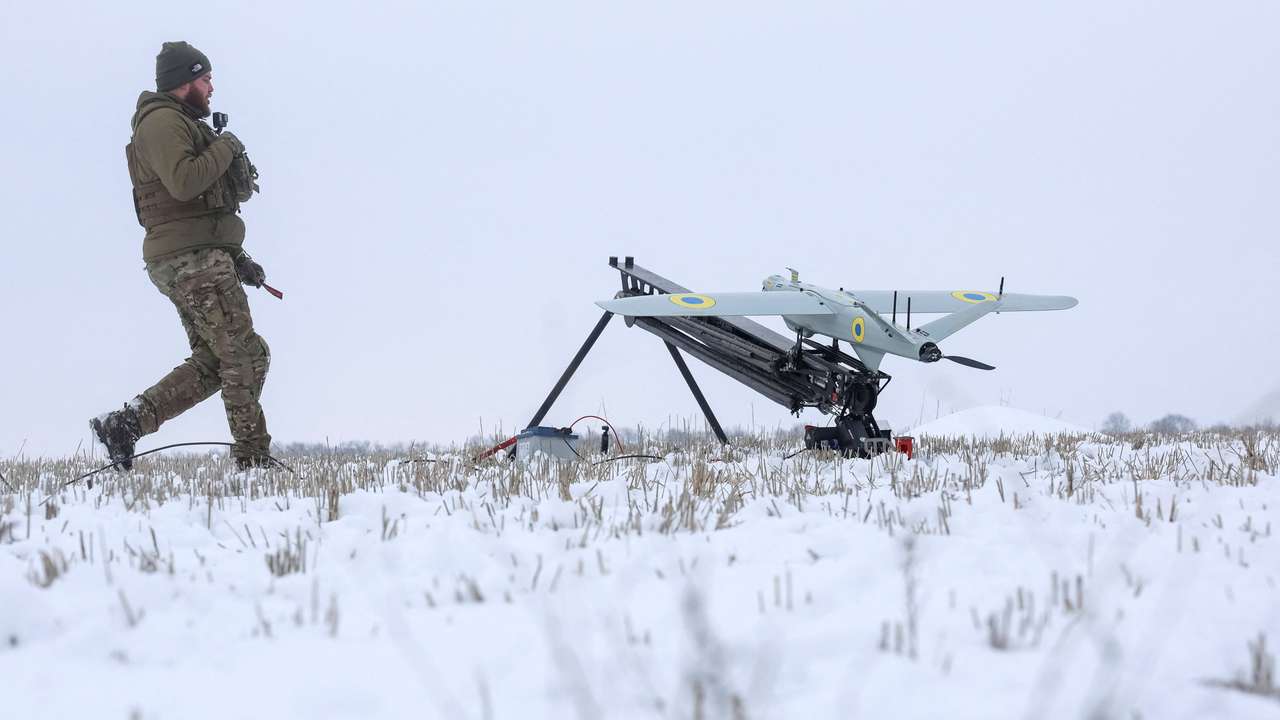A Ukrainian serviceman prepares to launch precision-guided loitering munition in Kharkiv region