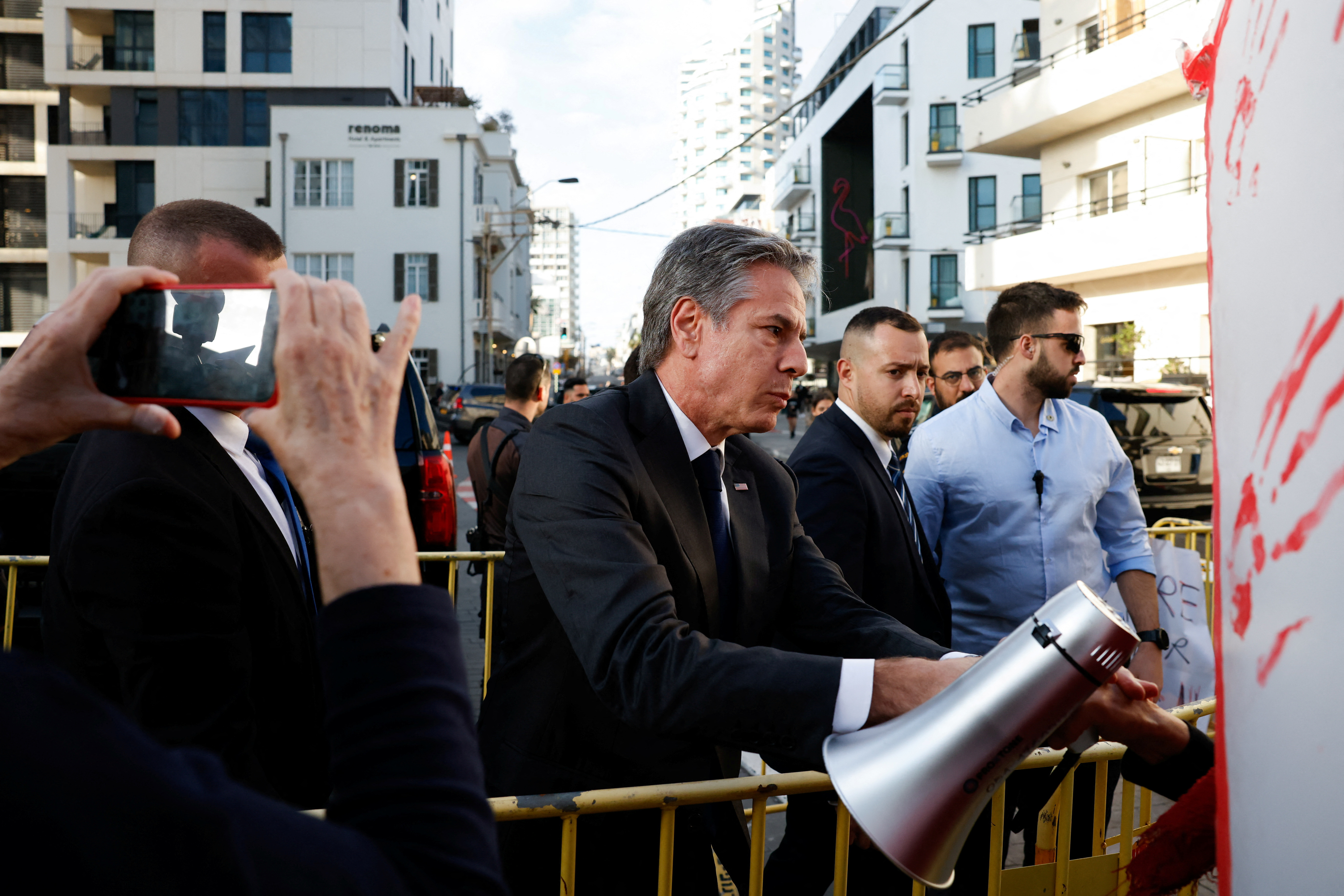 U.S. Secretary of State Antony Blinken waves, in Tel Aviv
