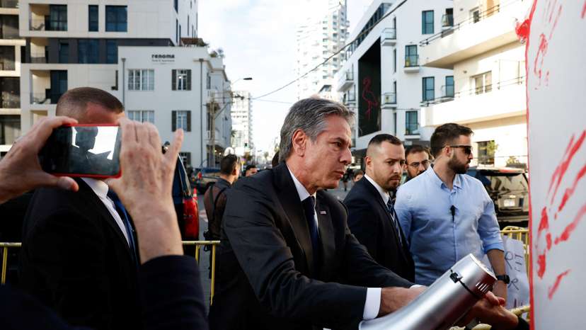 U.S. Secretary of State Antony Blinken waves, in Tel Aviv
