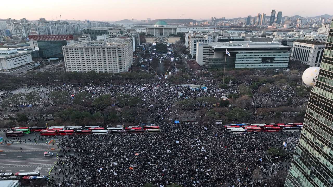 Protesters participate in a rally calling for the impeachment of South Korean President Yoon Suk Yeol, who declared martial law, which was reversed hours later, in front of the National Assembly in Seoul
