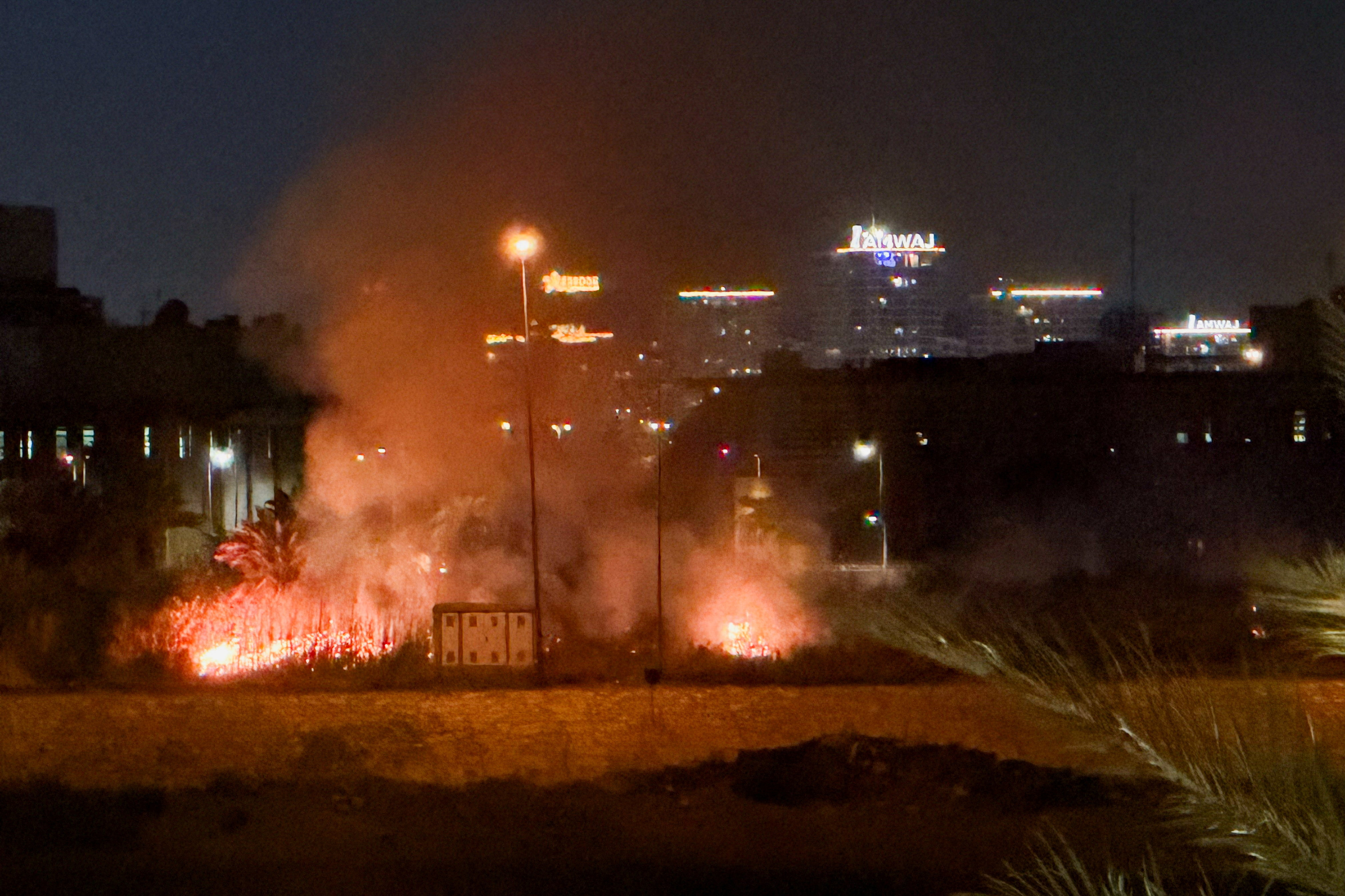 Smoke rises after an explosion at the U.S. Embassy compound in Baghdad, Iraq, following a rocket and drone attack, according to security sources