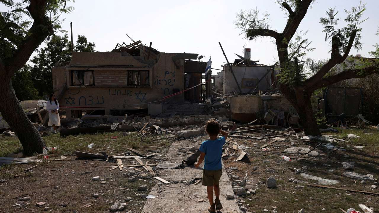 A rocket fired from the Gaza Strip damages a home, in central Israel
