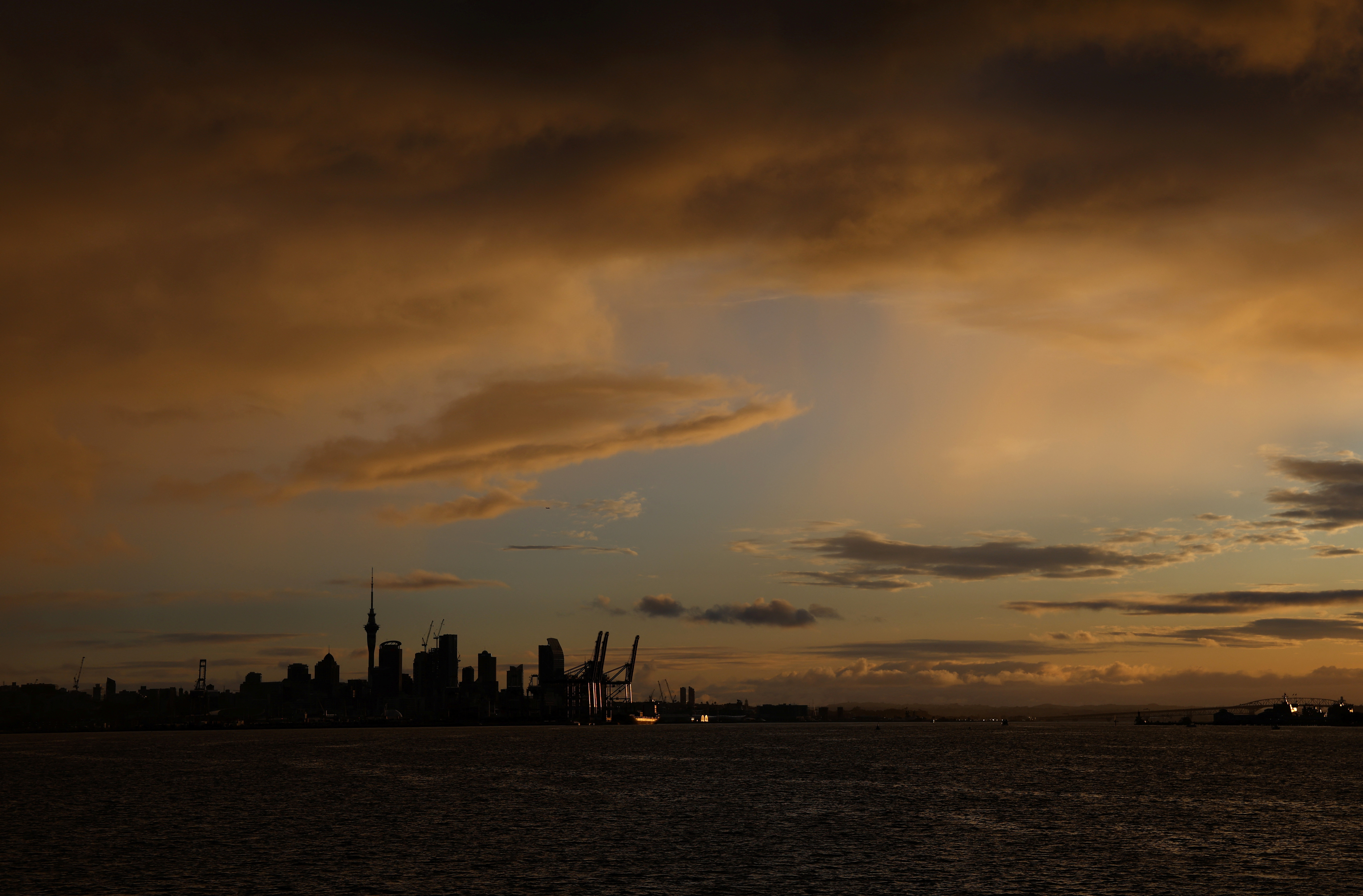 The Auckland skyline is seen at sunset