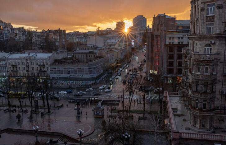 Evening sun sets over the skyline near Khreshchatyk Street in Kyiv