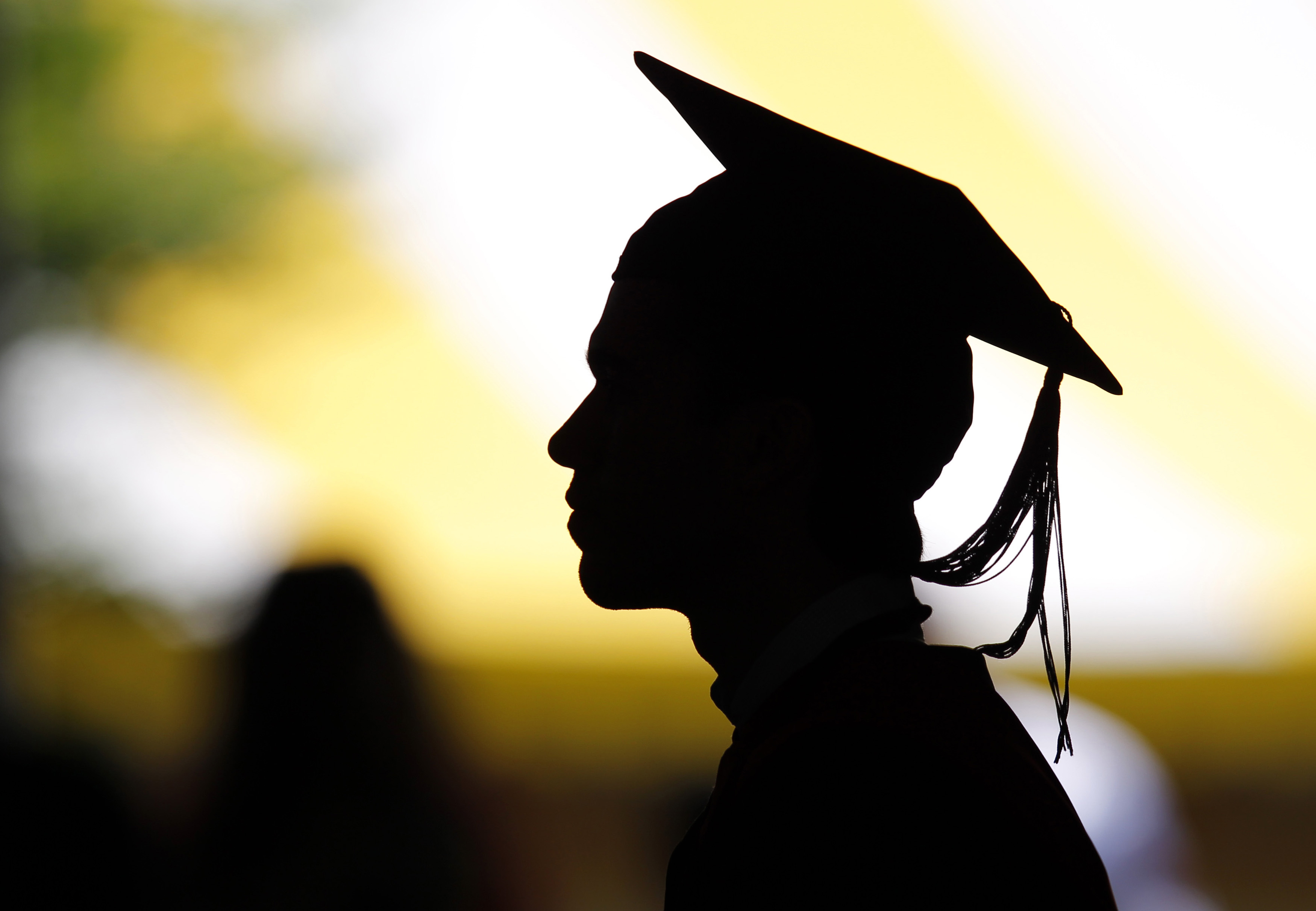 Students attend their graduation ceremony