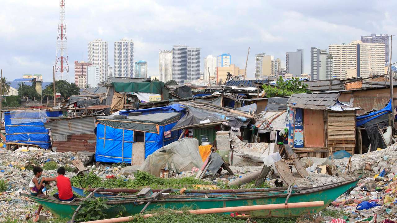 Youths are pictured at at a slum area in Baseco, Tondo city, metro Manila