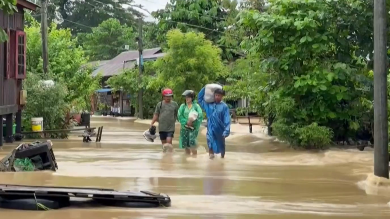 Myanmar residents take shelter in a school after severe flooding