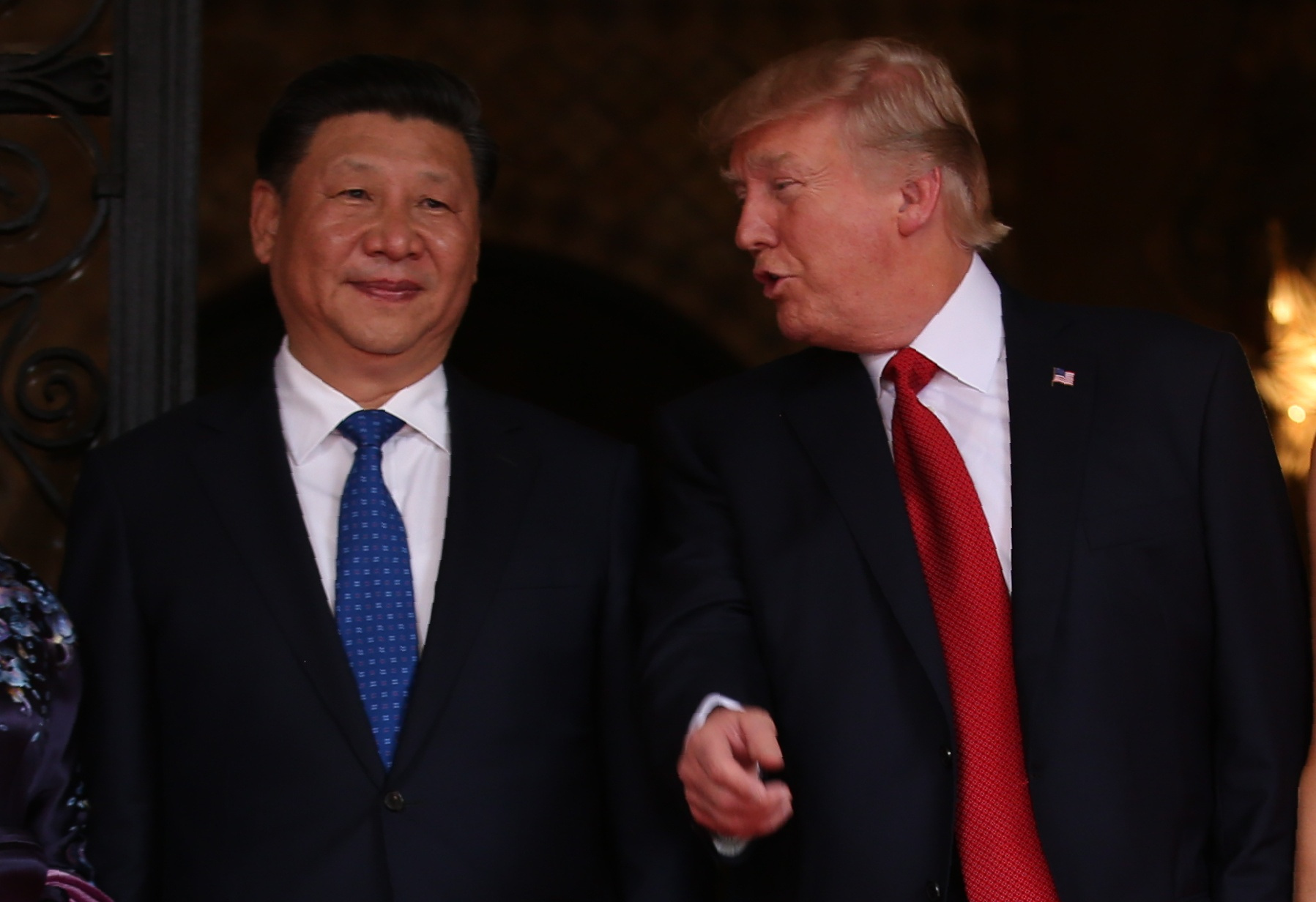 U.S. President Trump talks with Chinese President Xi as he welcomes Xi to the United States