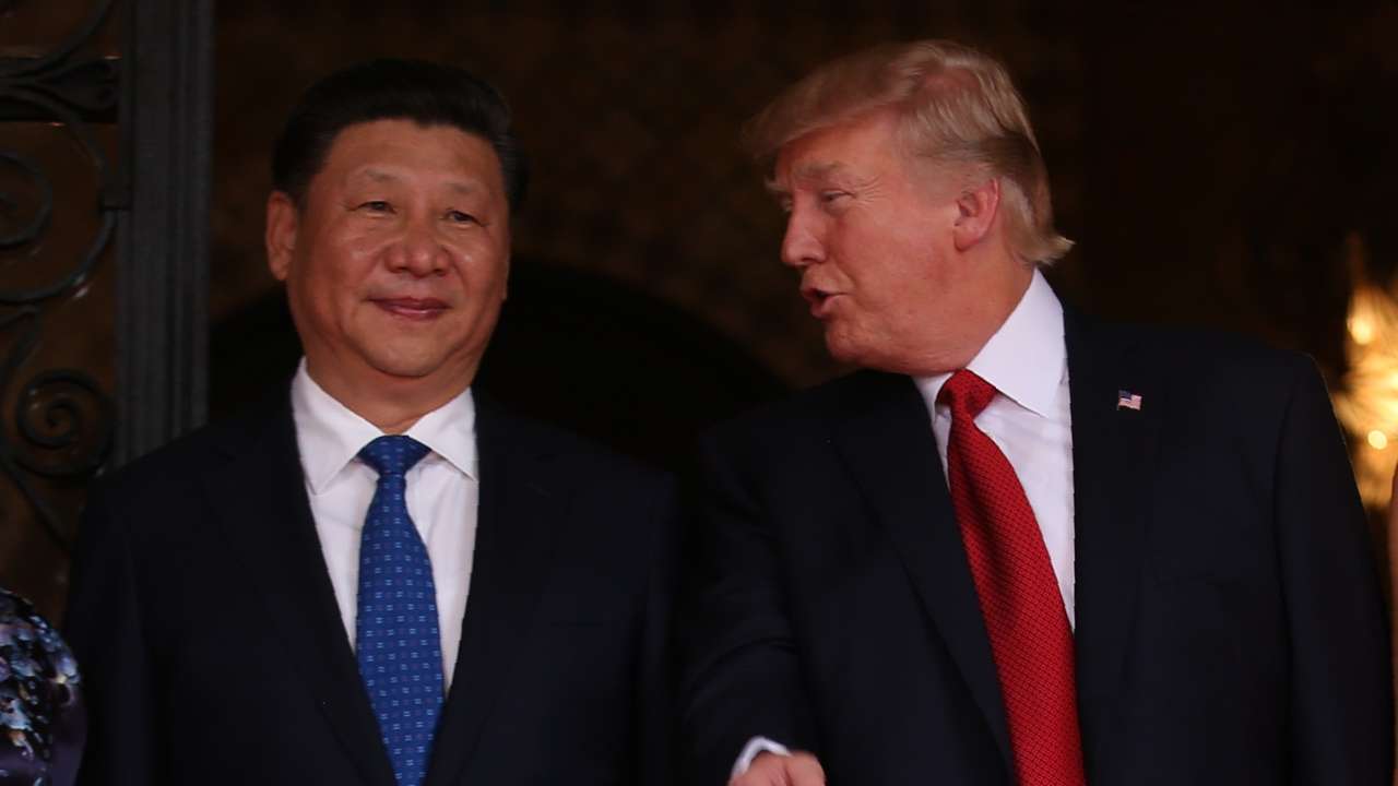 U.S. President Trump talks with Chinese President Xi as he welcomes Xi to the United States