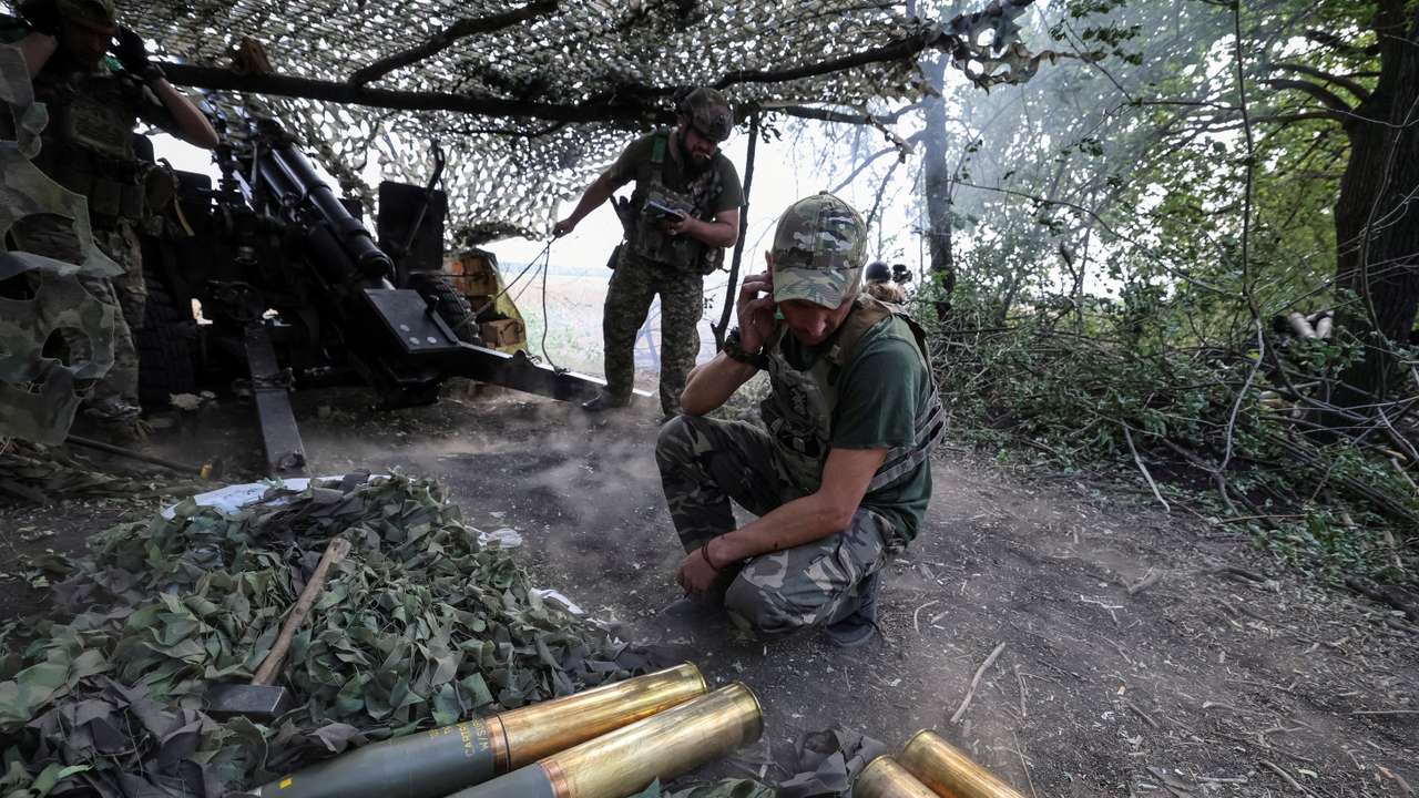 Artillerymen fire a howitzer towards Russian troops at a front line near Pokrovsk
