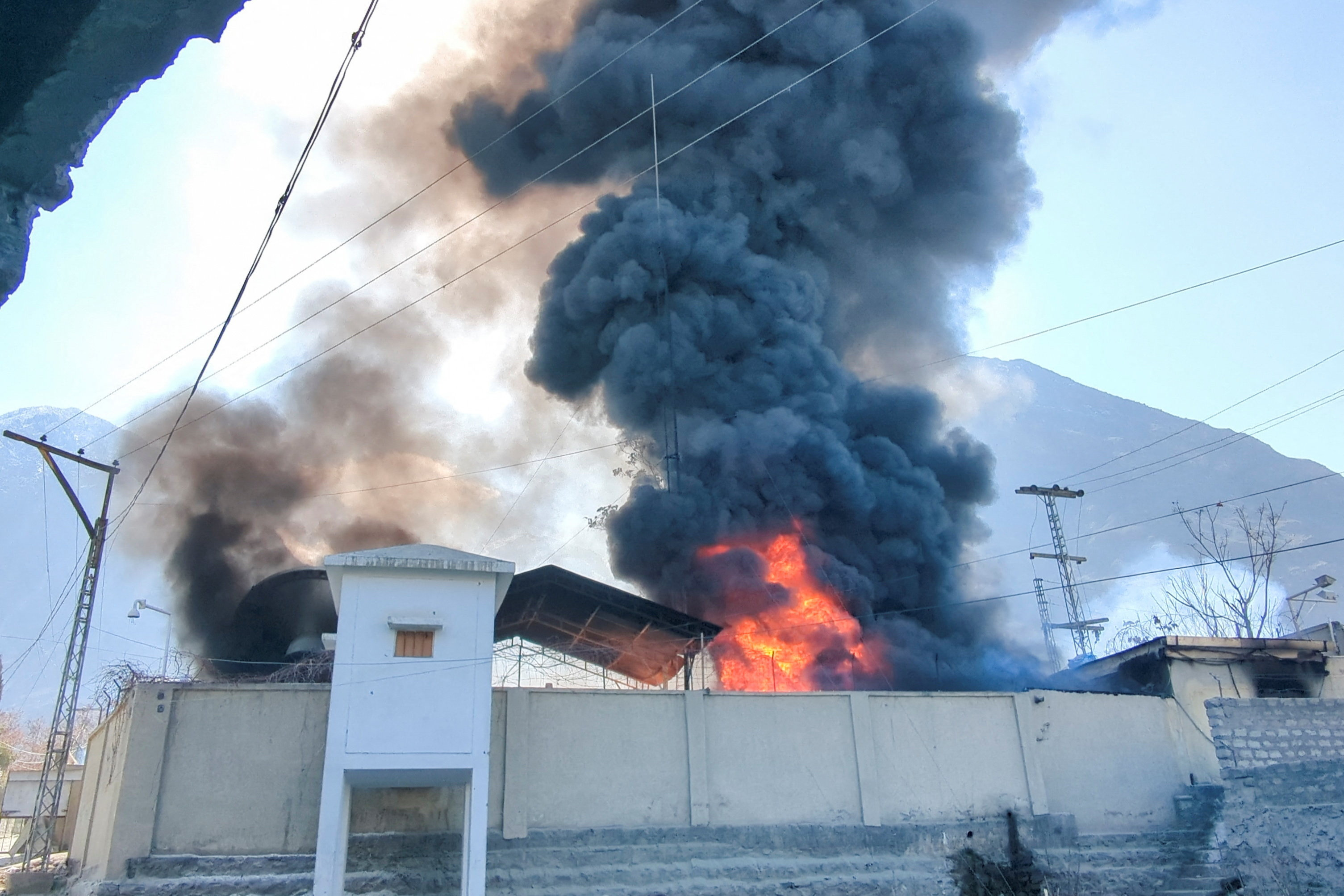Smoke and flames rise from the premises of U.N. office, after it was set ablaze by protesters, following news of U.S. and Israeli strikes on Iran that killed supreme leader Ayatollah Ali Khamenei, in the city of Gilgit