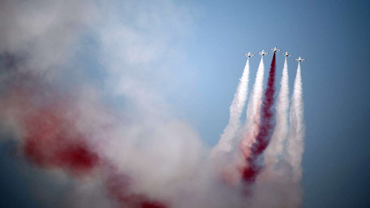 Turkish acrobatic aircrafts fly over a military parade to mark the 1974 Turkish invasion of Cyprus in response to a short-lived Greek-inspired coup, in the Turkish-controlled northern Cyprus, in the divided city of Nicosia