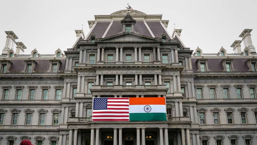 The flags of the United States and India on the Eisenhower Executive Office Building at the White House in Washington