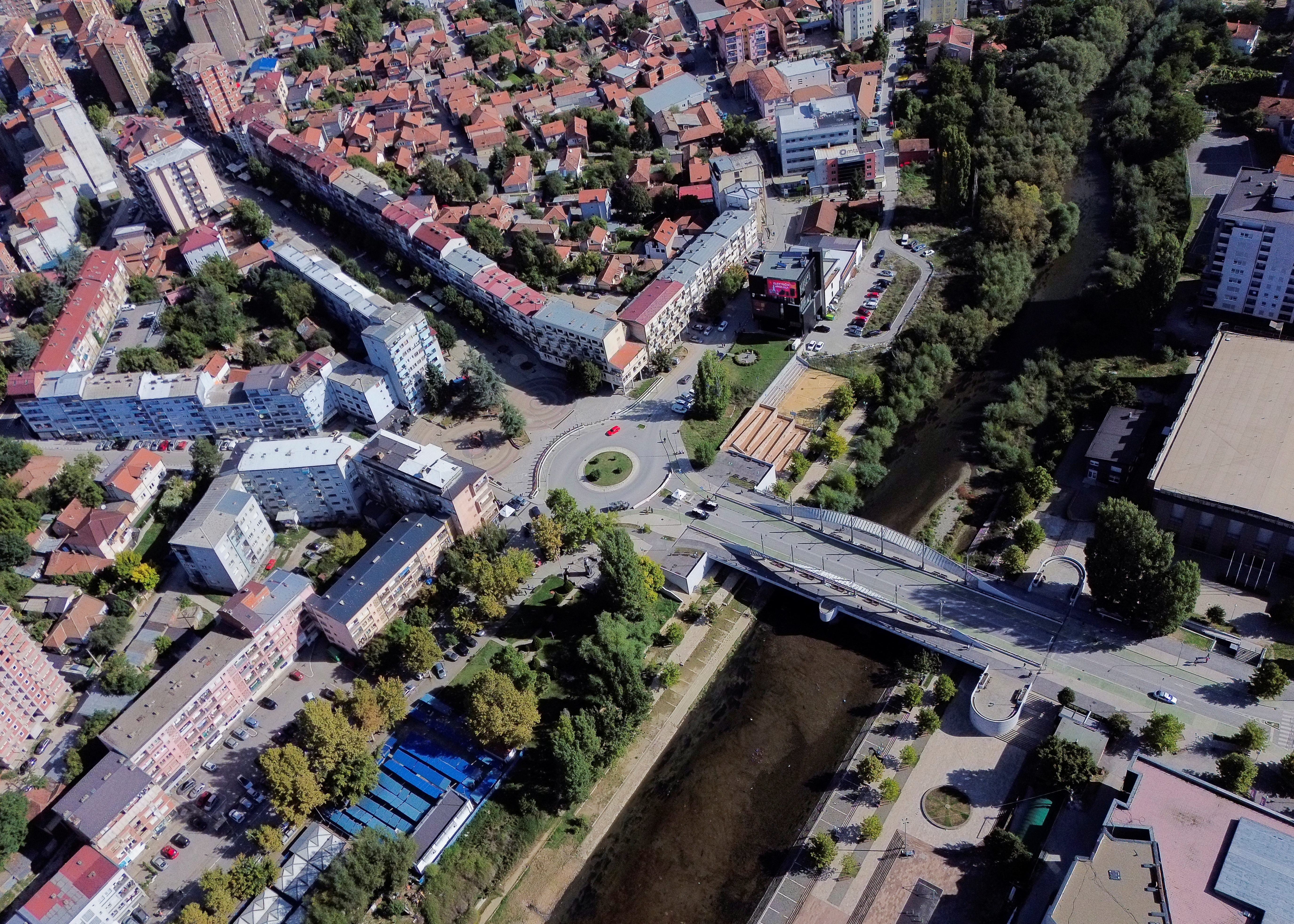A drone view shows the main bridge of the ethnically divided town, in Mitrovica