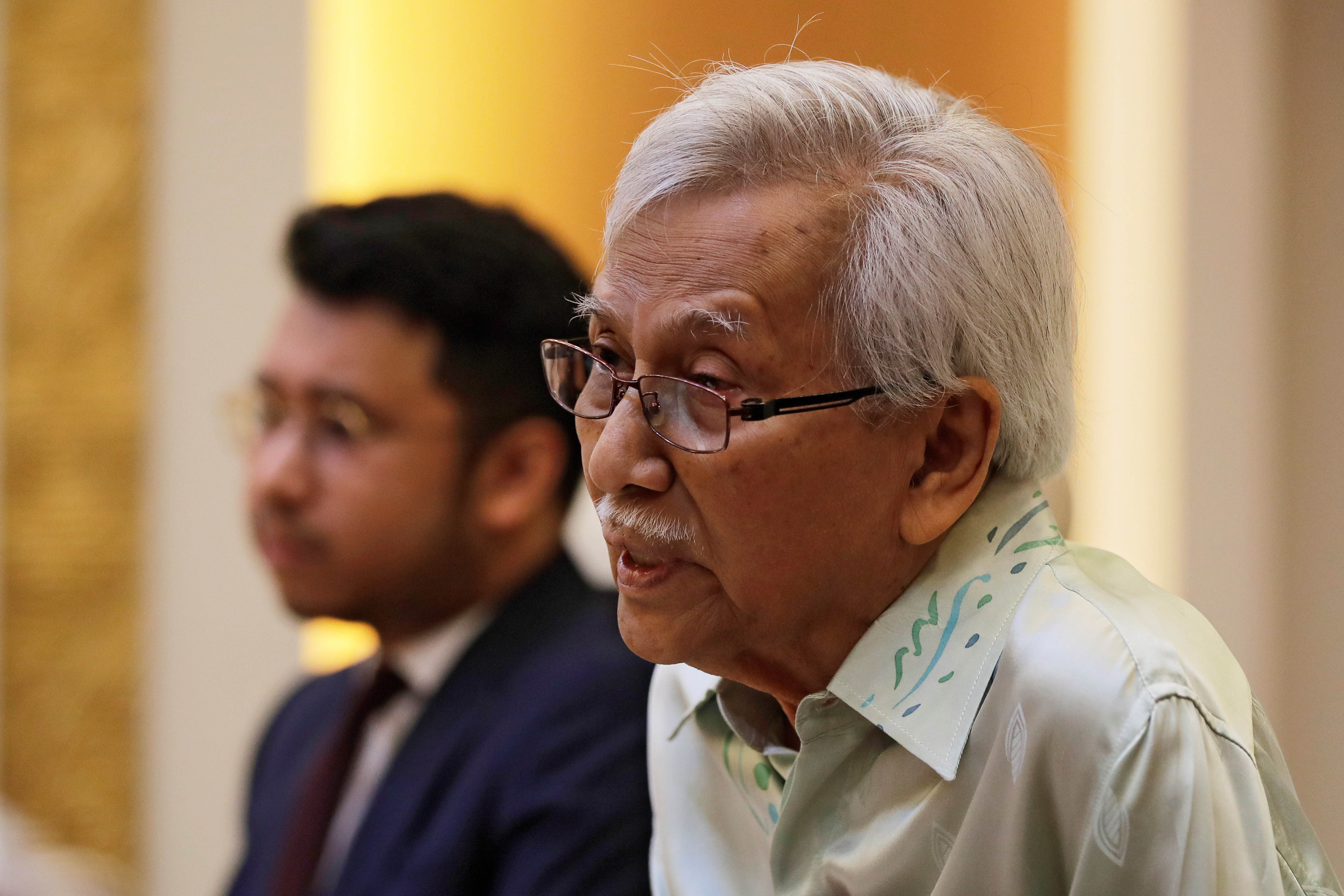 FILE PHOTO: Malaysia's new government advisor Daim Zainuddin speaks during a meeting with Chinese Foreign Minister Wang Yi at the Ministry of Foreign Affairs in Beijing
