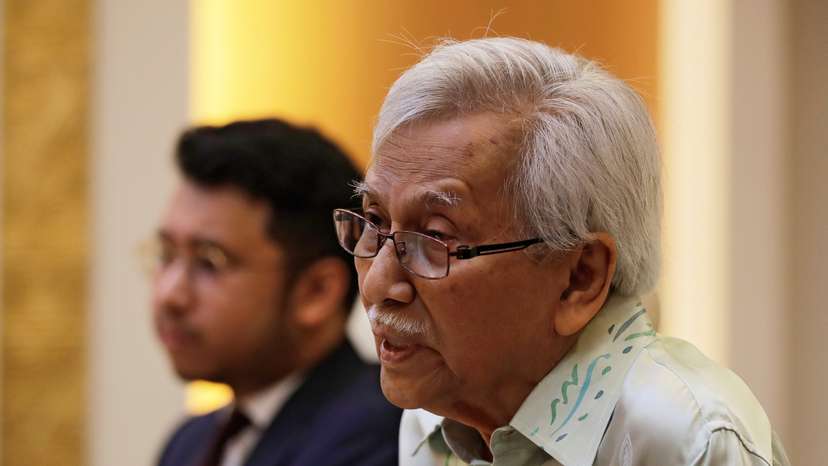 FILE PHOTO: Malaysia's new government advisor Daim Zainuddin speaks during a meeting with Chinese Foreign Minister Wang Yi at the Ministry of Foreign Affairs in Beijing