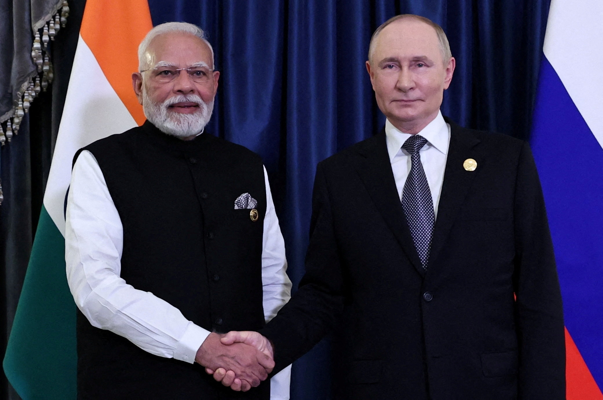 FILE PHOTO: Russian President Putin and Indian Prime Minister Modi meet at SCO summit in Tianjin