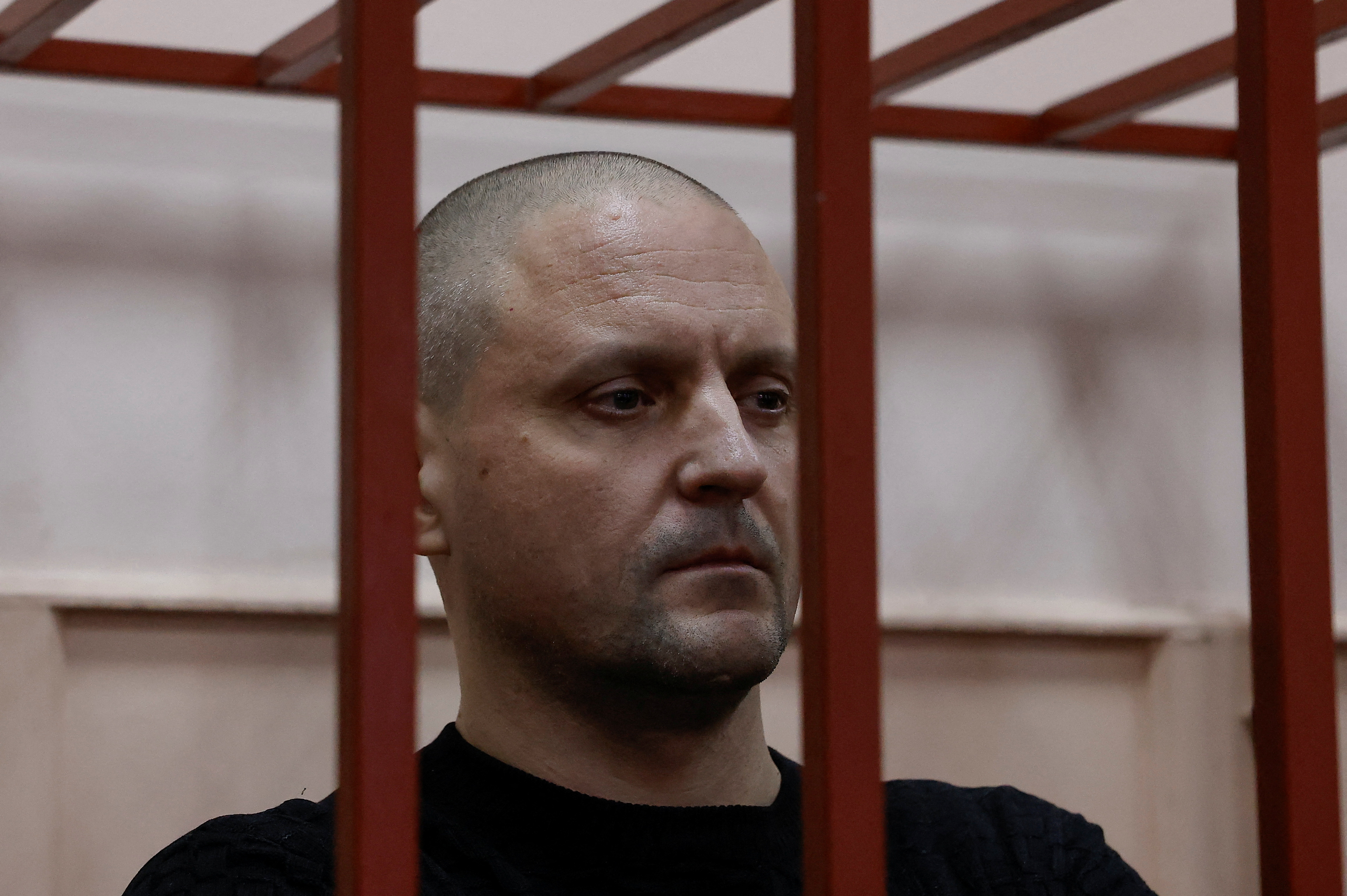 Sergei Udaltsov, a prominent Russian left-wing political activist, is seen in a court after been arrested and charged with "justifying terrorism", in Moscow