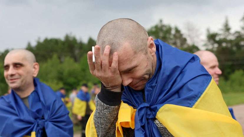 Ukrainian POWs after a swap at an unknown location in Ukraine