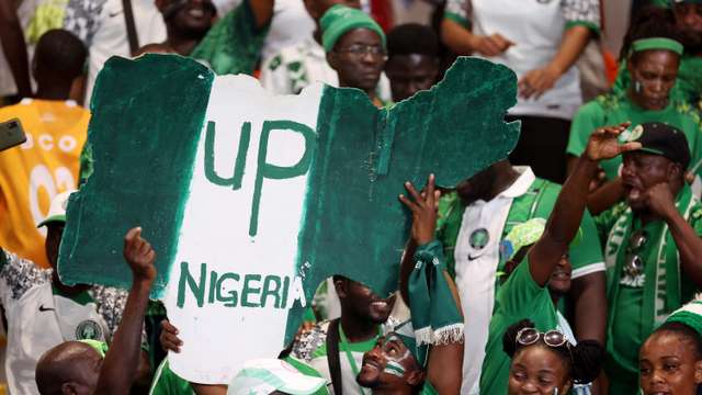Soccer Football - Africa Cup of Nations - Semi Final - Nigeria v South Africa - Stade de la Paix, Bouake, Ivory Coast - February 7, 2024  Nigeria fans celebrate after reaching the Africa Cup of Nations final REUTERS/Siphiwe Sibeko